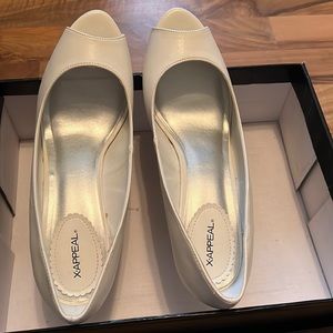 White size 8 1/2 X-Appeal. Worn once.